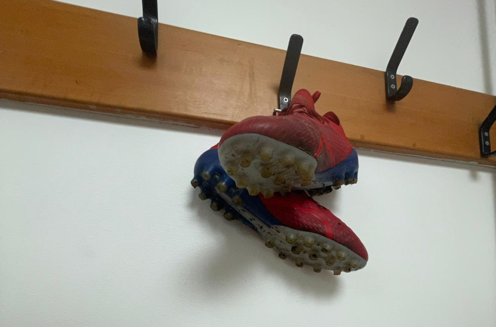 football boots hanging on a peg