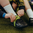 Silicon laceeze band covering football boot on astro,